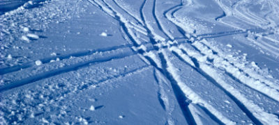 Aerial View Of Snow With Snowmobile Tracks On The Snow