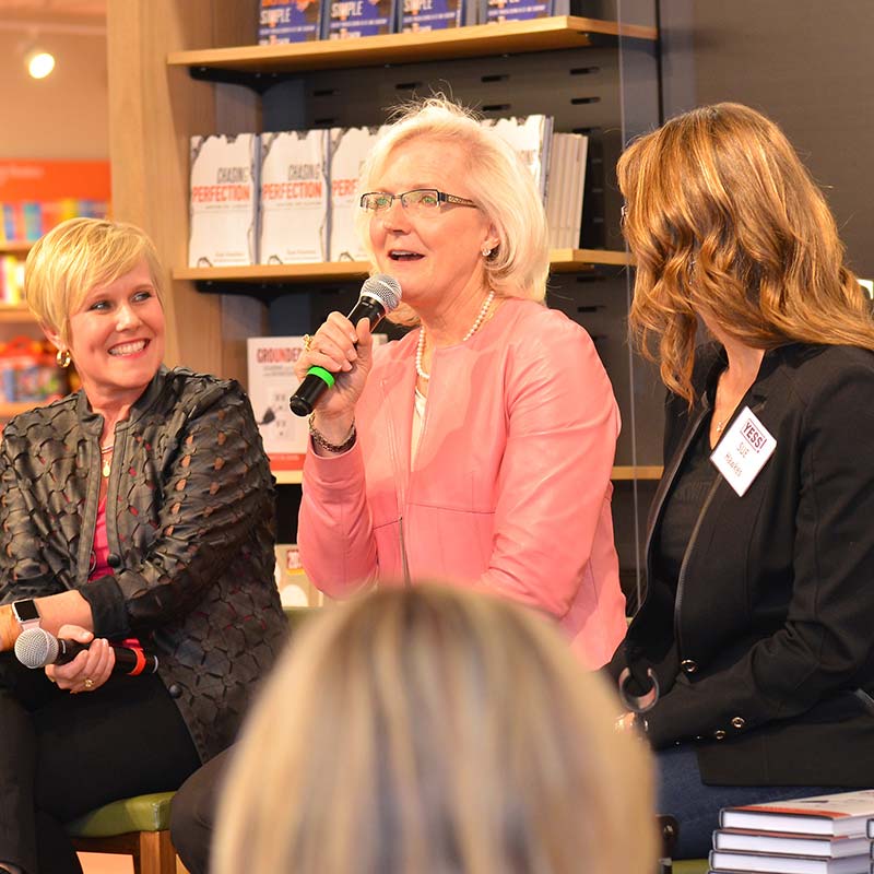 A photograph of Nancy M. Dahl speaking as a panelist at Barnes and Noble. She is seated next to Dina Simon and Sue Hawkes