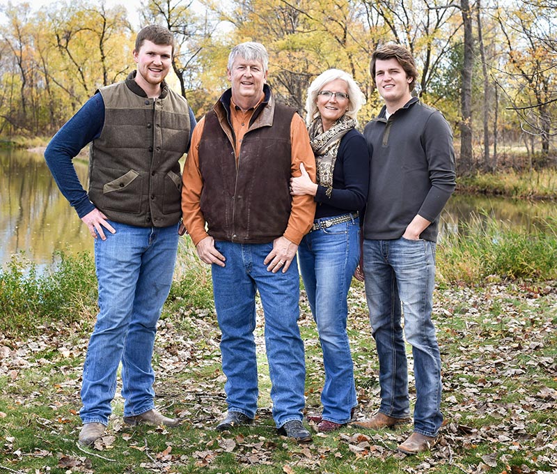 An outdoor photography of Nancy M. Dahl with her family including her husband Brian Dahl and her boys Erik Dahl and Jorgen Dahl